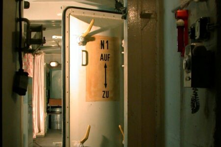 The picture shows a bunker airlock door standing open.